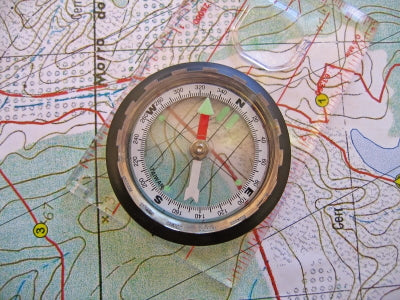 Map with a Compass laying over the top