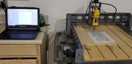 BobsCNC E4 CNC Router with laptop showing set up